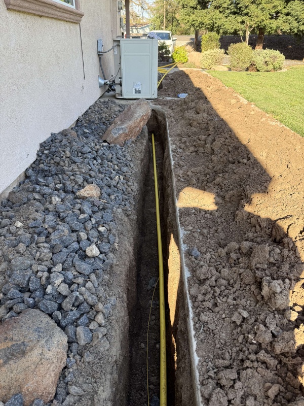 Licensed plumber working on a gas line installation