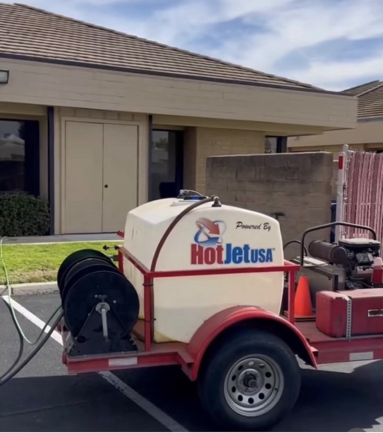 Technician hydro jetting a drain line at a Central Valley property